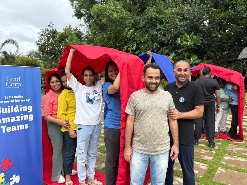 Teams racing through a red tunnel activity